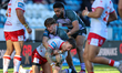 Jacob Gagai and Alex Chippendale make a tackle during the BetFred Super League match betwe...