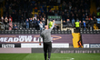 Paul Cook, manager of Chesterfield, gestures to his team's supporters during the Sky Bet L...