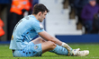 West Bromwich Albion's goalkeeper Max O'Leary waits for treatment on the ground following...
