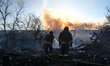 Firefighters extinguish a fire in Zaporizhzhia, Ukraine, on March 14, 2026. The fire was c...