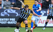 Nicholas Tsaroulla of Notts County competes with Armando Dobra of Chesterfield during the...