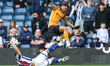 Cody Drameh of Hull City hurdles a challenge by Danny Imray of West Bromwich Albion during...
