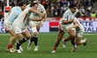 Yoram Moefana of France is tackled by Cadan Murley of England during the France (blues) vs...