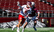 Brady Kurdyla of the Rutgers Scarlet Knights drives the ball against Robert Macmichael of...