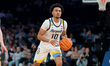 #10 Adrien Stevens of the Marquette Golden Eagles holds the ball during the BIG EAST Men's...