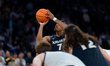 Isaiah Walker of the Xavier Musketeers shoots a free throw during the BIG EAST Men's Baske...