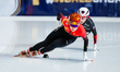 Zhang Chutong of China and Florence Brunelle of Canada compete in the Women's 1000m Final...