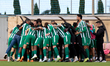 Floriana players and technical staff members huddle ahead of the YoHealth Malta Premier Le...