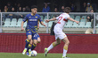 Abdou Harroui of Hellas Verona FC competes for the ball with Morten Frendrup of Genoa CFC...