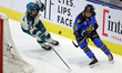 Natalie Spooner (24) attempts to evade Megan Carter (27) behind the net during a Professio...