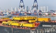 A cargo ship carrying Chinese-made trucks sets sail from Yantai Port in Yantai City, Shand...