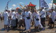 A Balinese woman is in a trance during a Melasti ceremony at Petitenget Beach on the islan...