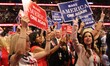 Delegates hold signs  during the Republican National Convention at Quicken Loans Arena in...