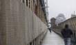 People jog across the Manhattan Bridge as rain and fog move into Manhattan, New York City,...
