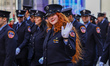 A Westchester County firefighter waves to the crowd while marching in the St. Patrick's Da...