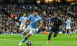 Matheus Nunes of Manchester City controls the ball under pressure from Vinicius Junior of...