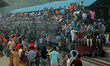 A large crowd gathers at Tongi Railway Station in Dhaka, Bangladesh, on March 18, 2026, as...
