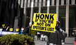 Members of the activist group Rise and Resist and their supporters gather for a weekly pro...