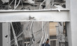A man works among the ruins of a building near a police station in a residential area in T...