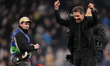 Diego Simeone, manager of Atletico Madrid, celebrates with away supporters at full time du...