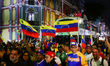 Fans accompany a welcome parade for part of the delegation that won the World Baseball Cla...