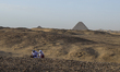 Muslim worshippers perform prayers for Eid al-Fitr near the ancient Egyptian Abusir Pyrami...