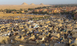 Muslim worshippers perform prayers for Eid al-Fitr near the ancient Egyptian Abusir Pyrami...