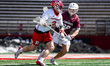 Haydn Sommer of the Rutgers Scarlet Knights drives the ball against Luke Healy of the Bell...