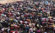 People attend Eid al-Fitr prayers at Badshahi Mosque in Lahore, Pakistan, on March 21, 202...