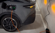 A grey Peugeot 408 Hybrid charges in the underground car park of ibis Madrid Norte Las Tab...