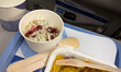 An in-flight meal is served on an Aegean Airlines flight between Madrid and Athens, seen o...