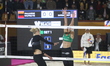 Alisa Batenhorts of the United States spikes the ball against Aine Raupelyte of Lithuania...