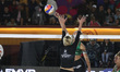 Aine Raupelyte of Lithuania spikes the ball against Alisa Batenhorts of the United States...