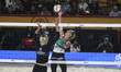 Monika Paulikiene of Lithuania spikes the ball against Alisa Batenhorts of the United Stat...