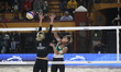 Alisa Batenhorts of the United States spikes the ball against Monika Paulikiene of Lithuan...