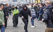 Police guide Sunderland fans through Newcastle fans during the Premier League match betwee...