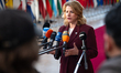 Latvia's Prime Minister Evika Silina speaks to journalists as she arrives prior to the Eur...