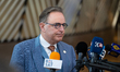 Belgium's Prime Minister Bart De Wever speaks to journalists as he arrives prior to the Eu...