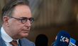 Belgium's Prime Minister Bart De Wever speaks to journalists as he arrives prior to the Eu...