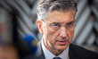 Croatia's Prime Minister Andrej Plenkovic speaks to journalists as he arrives prior to the...