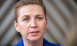 Denmark's Prime Minister Mette Frederiksen speaks to journalists as she arrives prior to t...