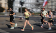 Runners pass Charles de Gaulle Roundabout during the 20th Warsaw Half Marathon in Warsaw,...