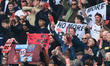 West Ham fans hold protest banners during the Premier League match between Aston Villa and...