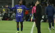Alvaro Angulo #77 of Pumas receives instructions from Head Coach Efrain Juarez during the...