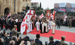 A solemn procession carries Catholicos-Patriarch of All Georgia, Ilia II, from the Holy Tr...