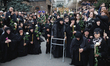 A solemn procession carries Catholicos-Patriarch of All Georgia, Ilia II, from the Holy Tr...