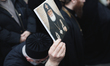 A solemn procession carries Catholicos-Patriarch of All Georgia, Ilia II, from the Holy Tr...