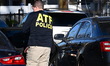 Federal agents with the Bureau of Alcohol, Tobacco, Firearms and Explosives (ATF) work at...