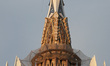 The Sagrada Familia with the entire cross of the Tower of Jesus Christ uncovered after the...