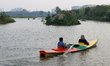 Visitors ride kayaks in Uttara during the Eid al-Fitr holiday in Dhaka, Bangladesh, on Mar...
